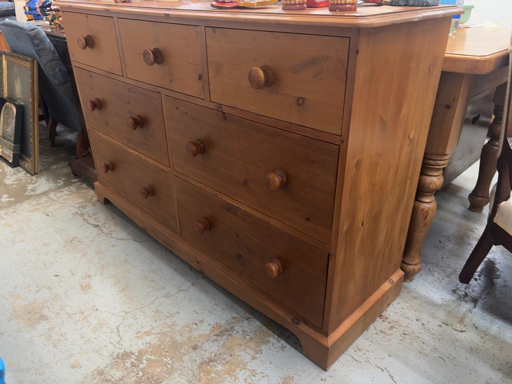 Lot 490: A Late Victorian Style Pine Asymmetric Chest of Seven Drawers