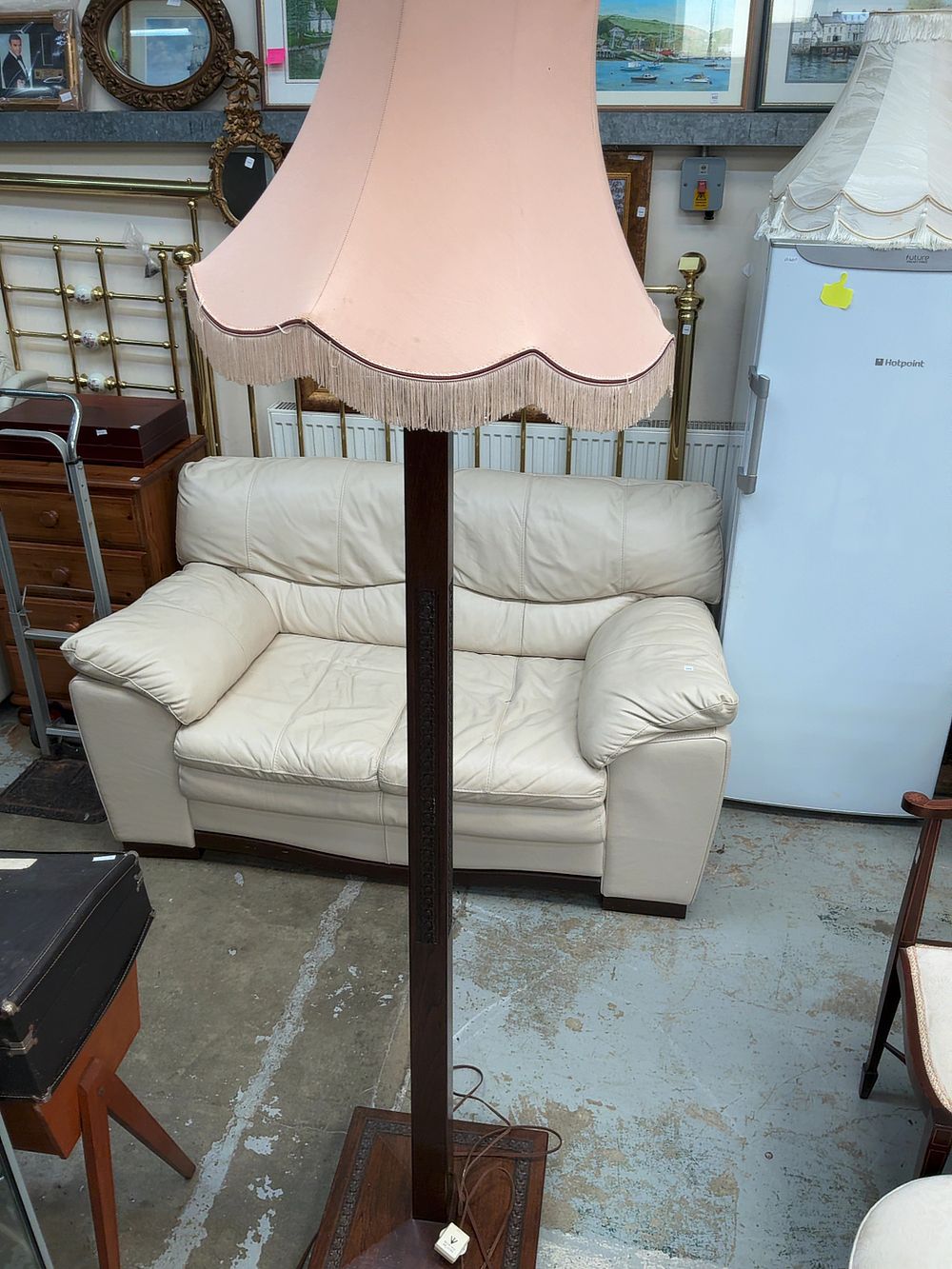 Lot 491: A Mid-20th Century Dark-Stained Wooden Standard Lamp with Fringed Fabric Shade