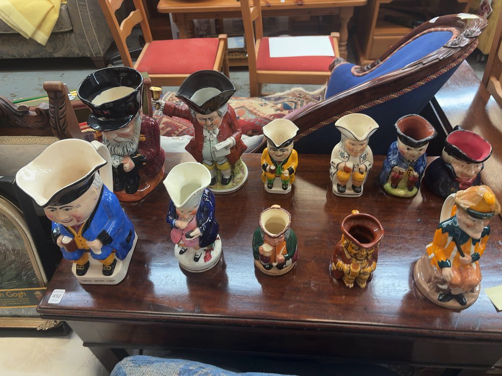 Lot 494: A Collection of Eleven Ceramic Toby and Character Jugs including Lorna Doone Farm and The Drinker Examples