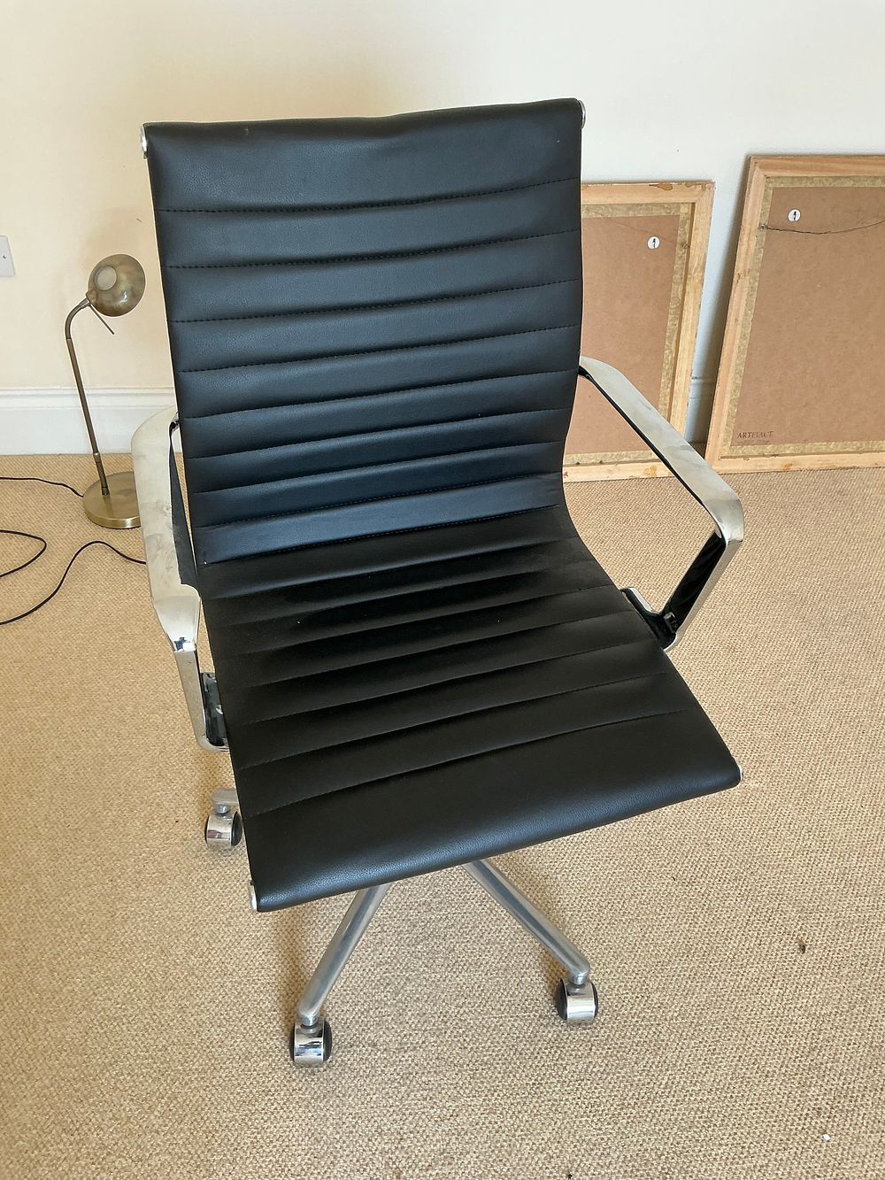 Lot 504: A Contemporary Eames Style High Back Ribbed Black Office Chair