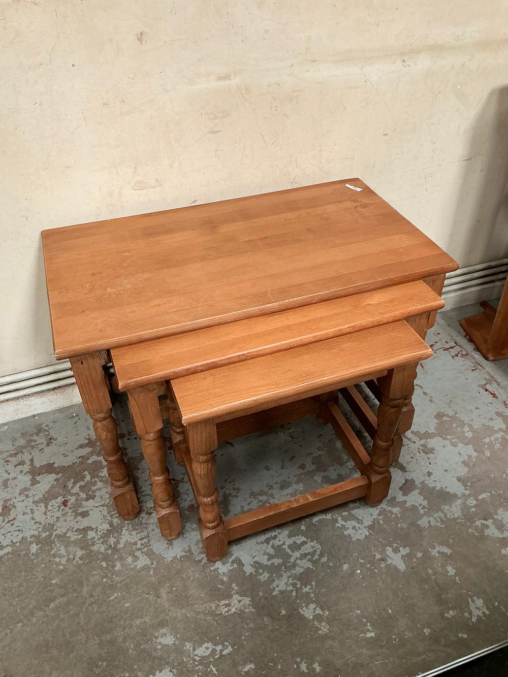Lot 519: A Trio of Three Traditional Style Solid Wood Nesting Tables