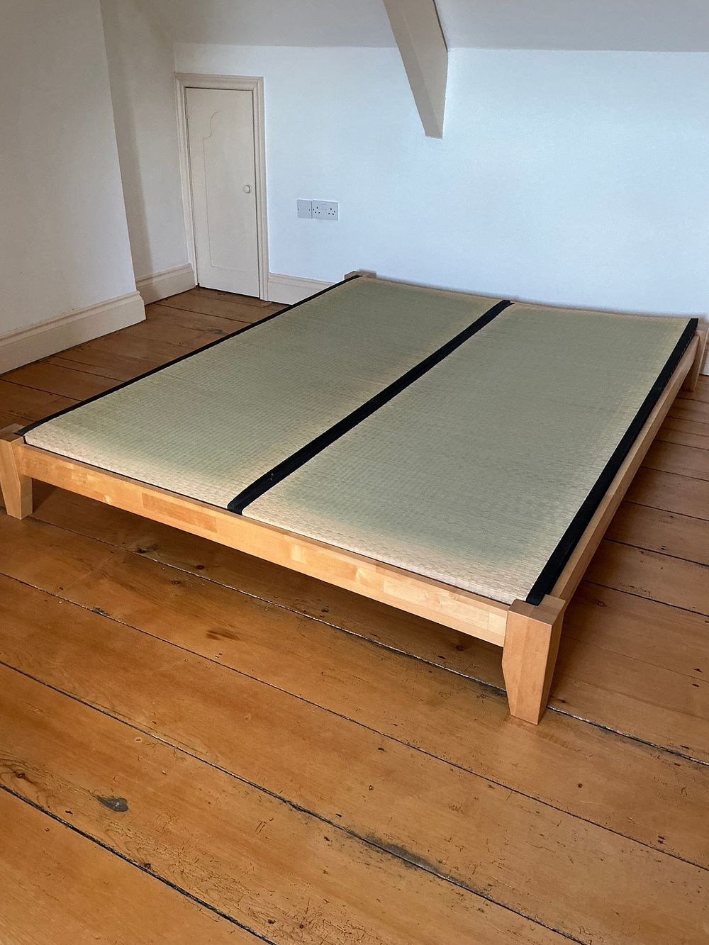 Lot 520: A Japanese Style Solid Hardwood Platform Bed with Two Tatami Mats