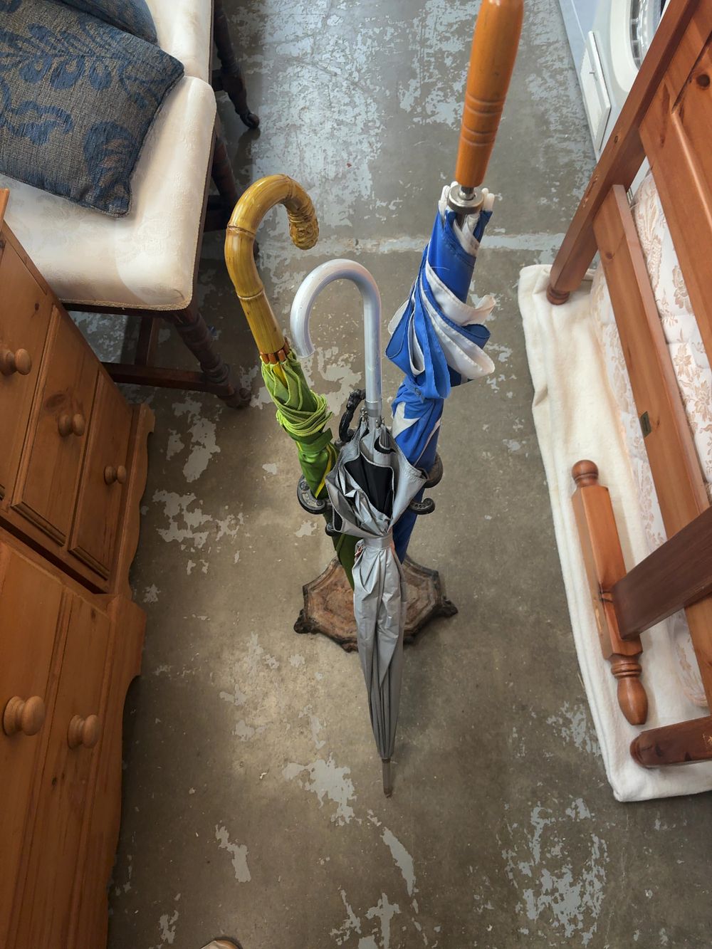 Lot 521: A Mixed Lot of a Victorian Style Cast Iron Umbrella Stand and Various Umbrellas