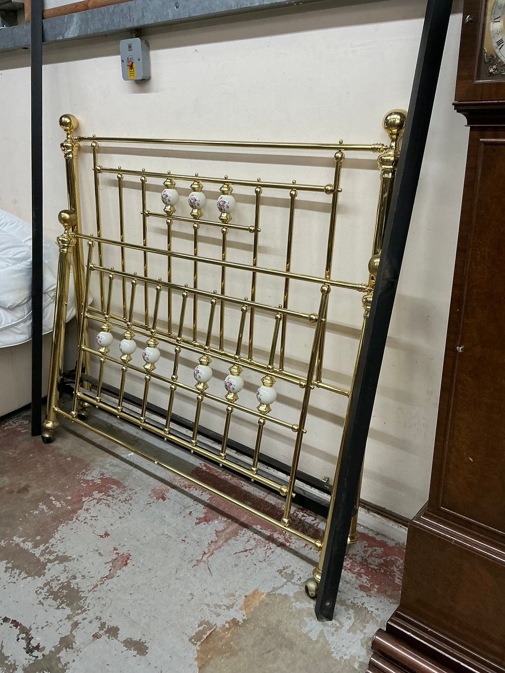 Lot 546: A Pair of Victorian Style Brass and Porcelain Bedstead Ends