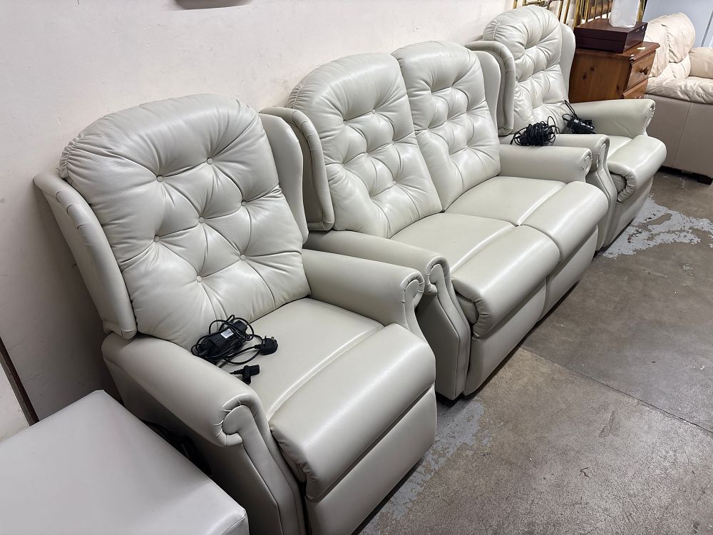 Lot 551: A Set of Four Traditional Style  Leather Electric Reclining Lounge Furniture Items