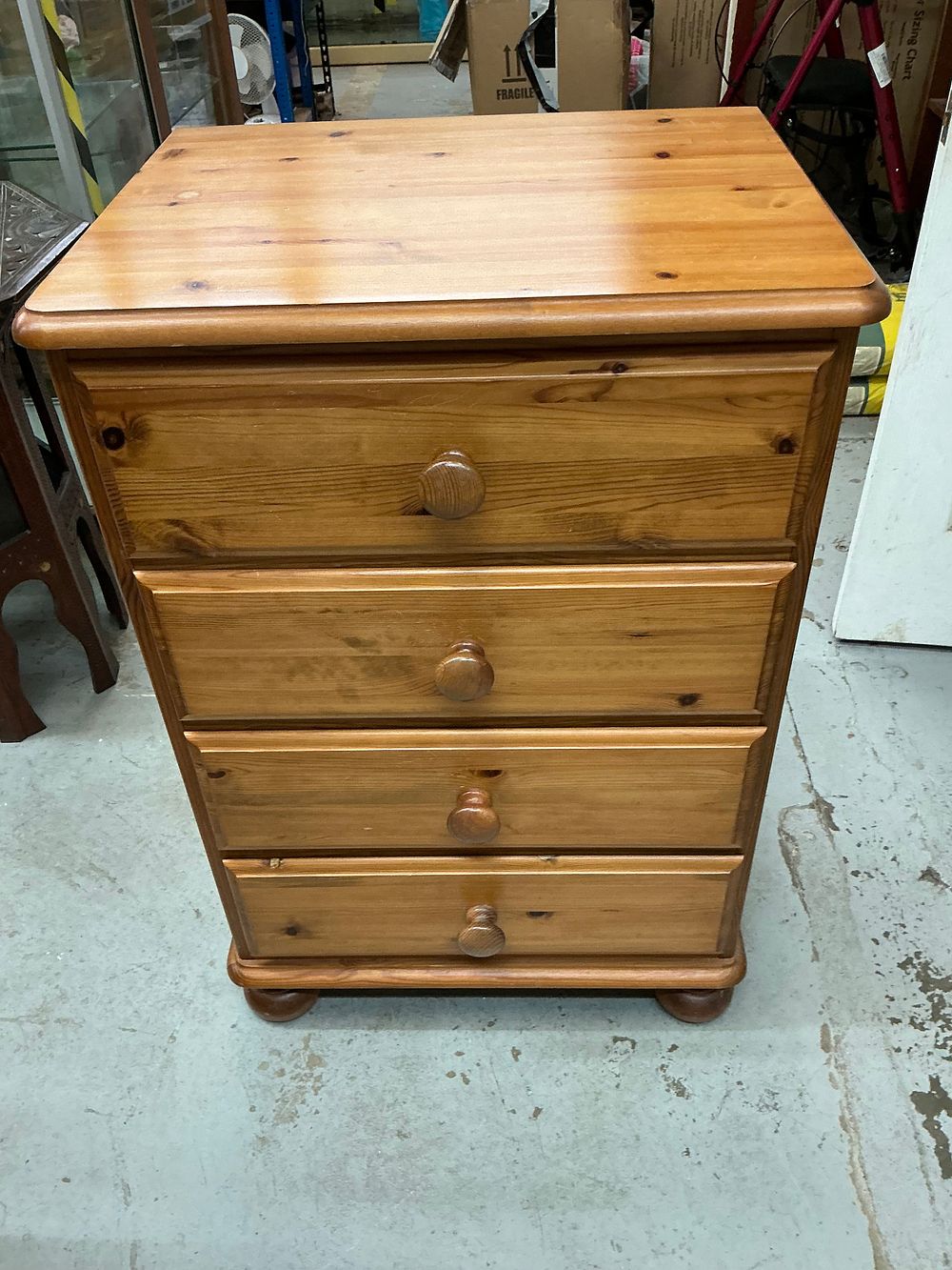 Lot 552: A Late Twentieth Century Ducal Ltd Victoria Range Solid Pine Chest of Four Drawers