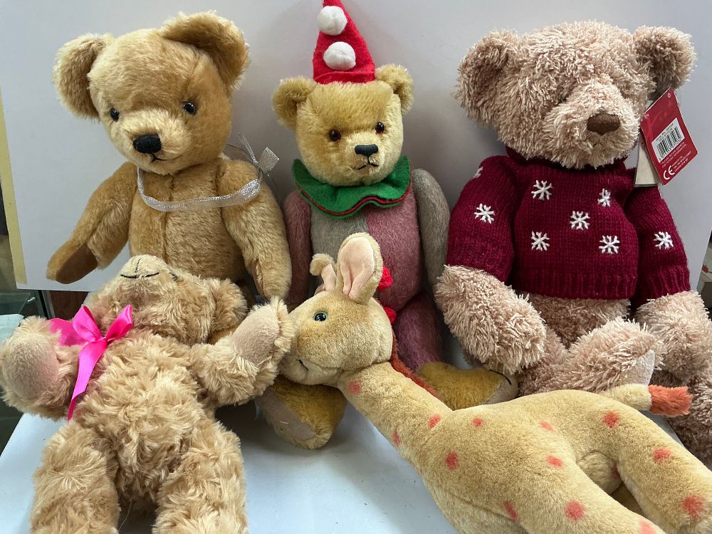 Lot 15: A Collection of Five Vintage and Commemorative Plush Toys Including Merrythought, Hamleys, and Avon Examples