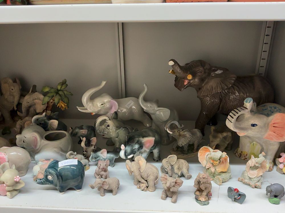 Lot 29: A Collection of Elephant Figurines and Decorative Objects Including Tuskers Examples