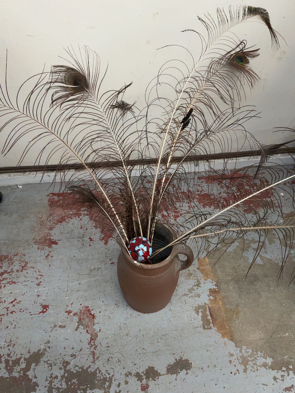 Lot 39: A Collection of a Salt Glazed Stoneware Jug Decorative Feathers and a Glass Watering Bulb