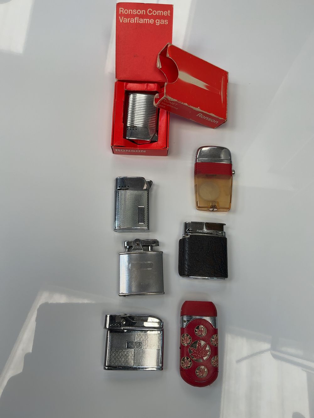 Lot 45: A Collection of Vintage Metal and Plastic Cigarette Lighters Including Ronson and Mosda Examples