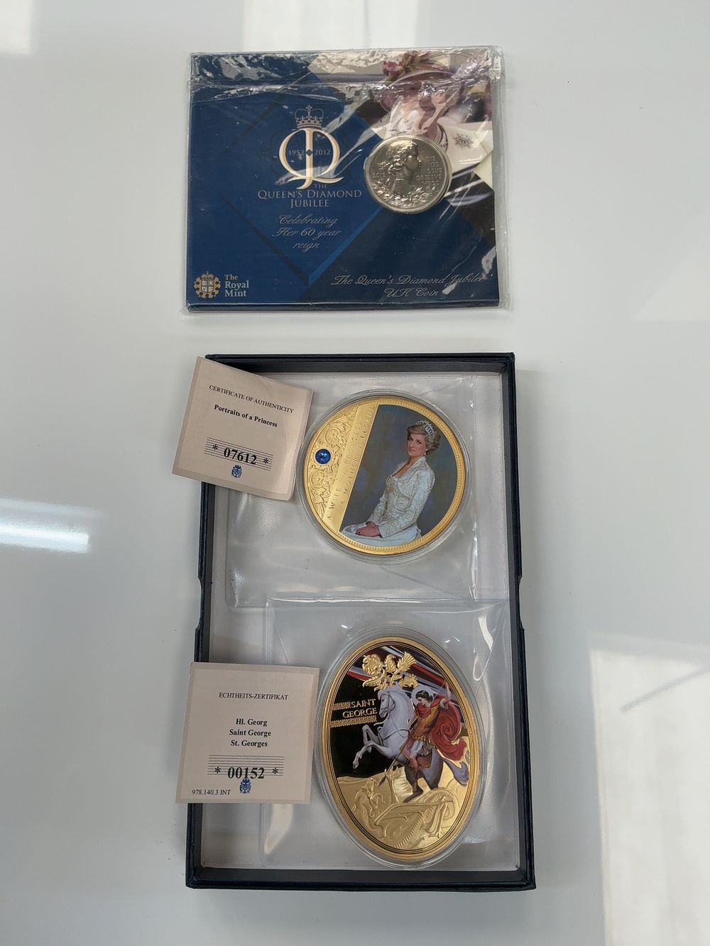 Lot 48: A Set of Three British Commemorative Numismatic Items Including a Royal Mint Five Pound Coin in Presentation Case