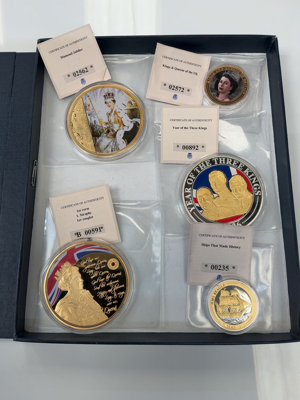 Lot 49: A Set of Five Windsor Mint Gold and Silver-Plated Copper Medals with Presentation Case