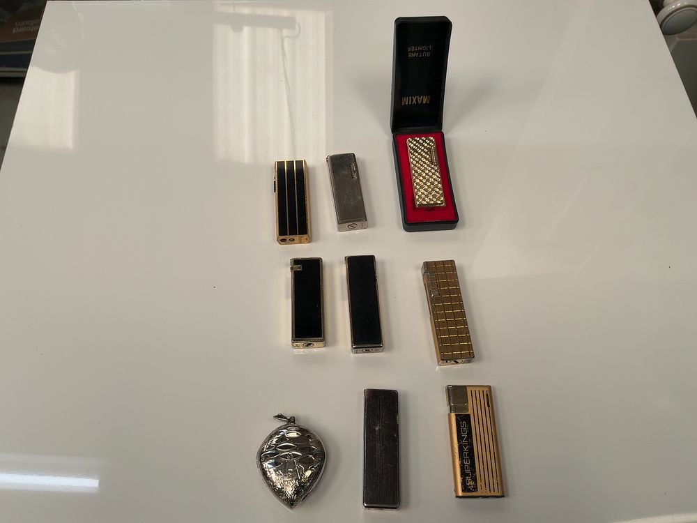 Lot 54: A Collection of Vintage Metal Pocket Lighters including Ronson and Colibri examples with Presentation Case