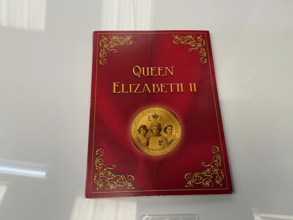 Lot 55: A Collection of Seven Gold-Plated Commemorative Medallions and a Gibraltar Coin with Presentation Case