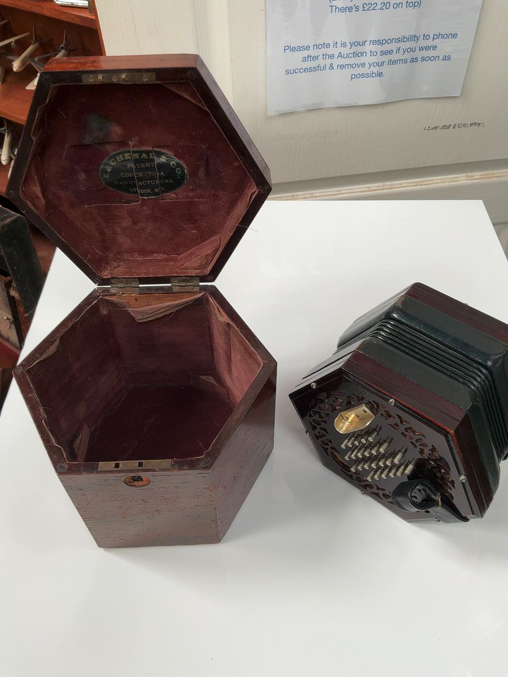 Lot 62: A Lachenal and Company Rosewood and Leather Thirty One Button Anglo Concertina in  Case