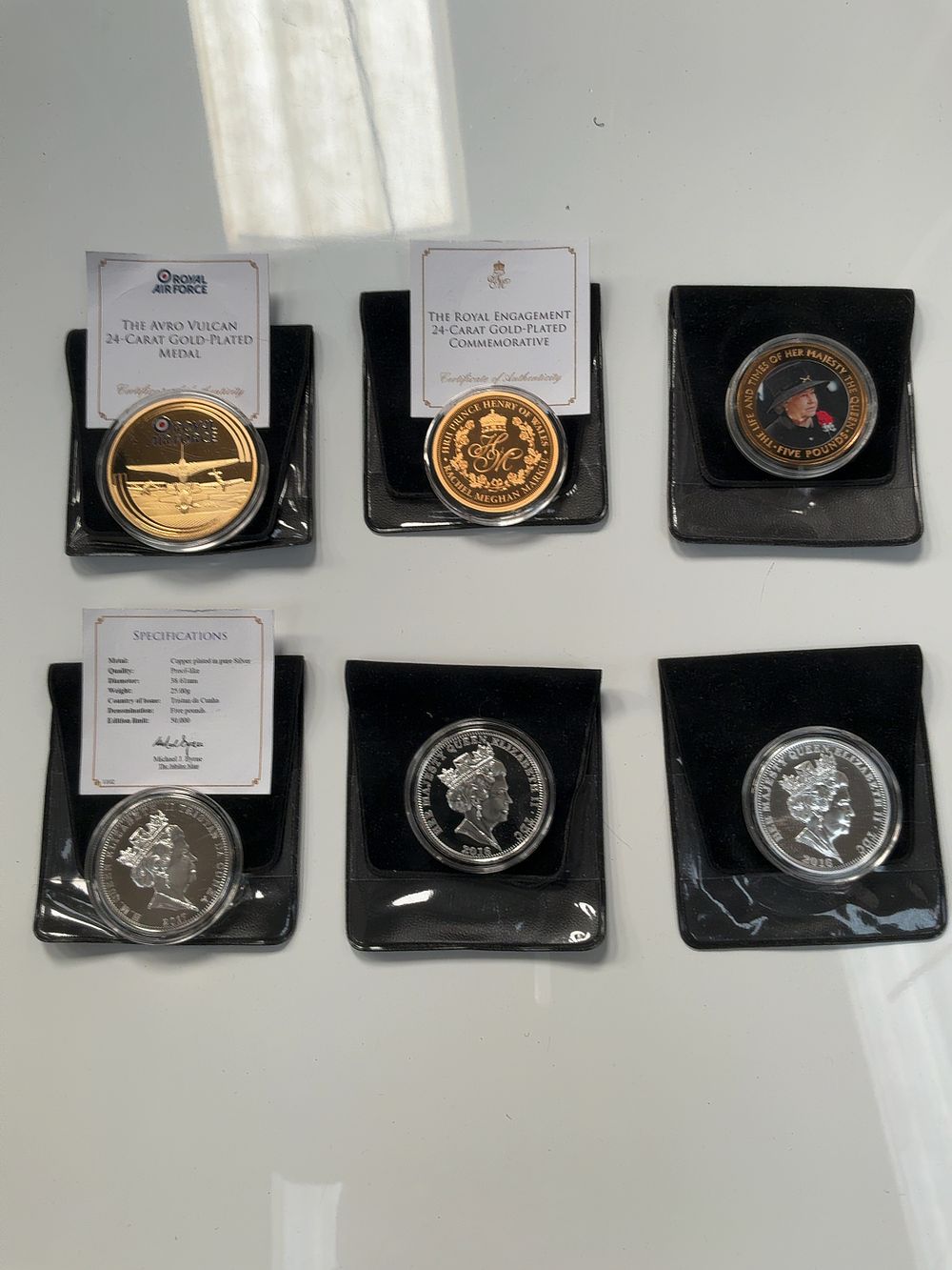 Lot 71: A Collection of Six Royal and Military Commemorative Gold-Plated and Silver-Plated Medals and Coins Including Jubilee Mint Examples