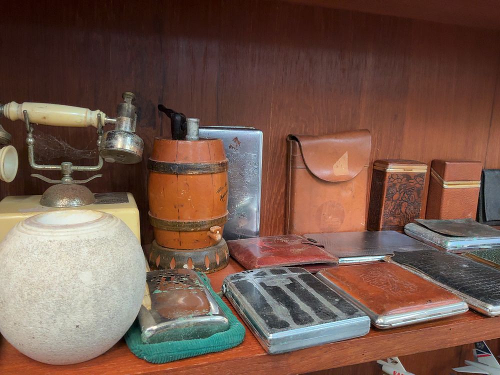 Lot 79: A Collection of Vintage Mixed Material Smoking Accessories Including Lucky Devil and Wonder Ash Tray Examples