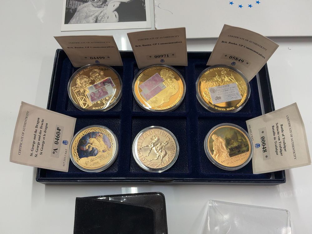 Lot 104: A Set of Six Commemorative Gold-Plated Copper and Cupro-Nickel Medals and Coins in Presentation Case