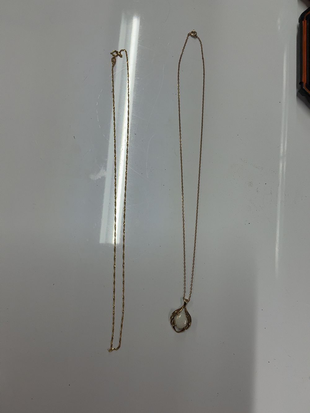 Lot 111: Two 9ct Yellow Gold Necklaces Including an Opal Pendant Necklace