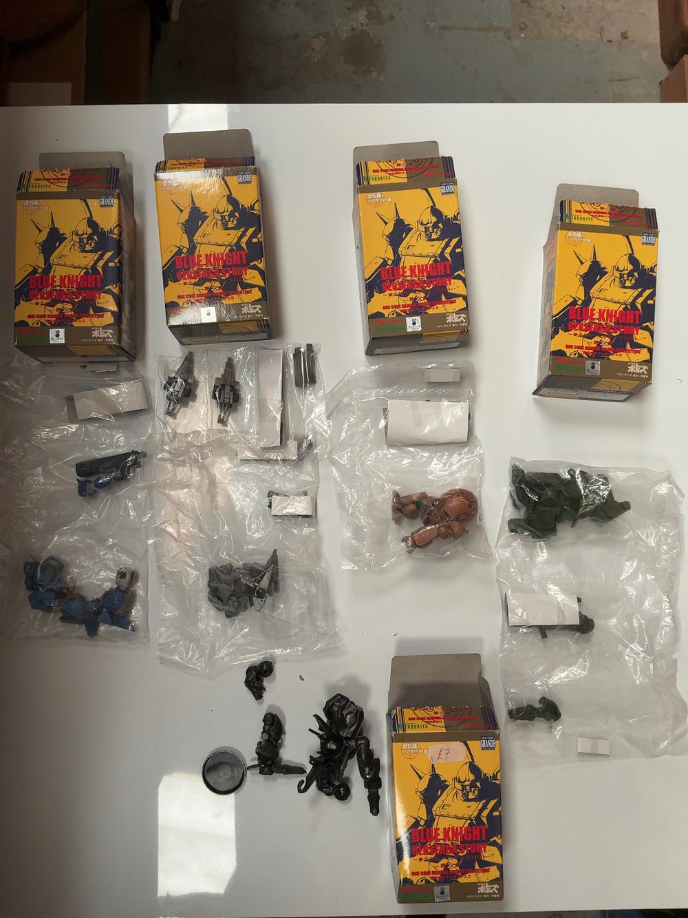 Lot 118: A Collection of Kotobukiya Blue Knight Berserga Story One Coin Grande Figure Collection Plastic Figures with Original Boxes