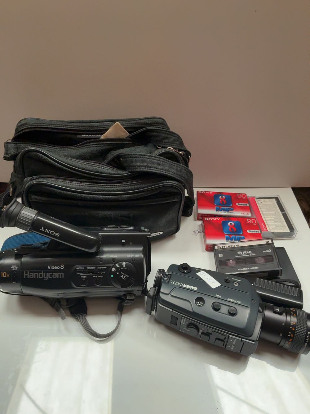 Lot 122: A Collection of Vintage Plastic and Metal Video and Cine Cameras Including Sony Bauer and Hitachi Examples in Cases