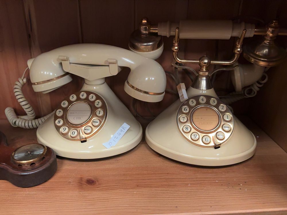 Lot 131: A Collection of Vintage style telephones and Decorative Items Including Huger and Chic Examples