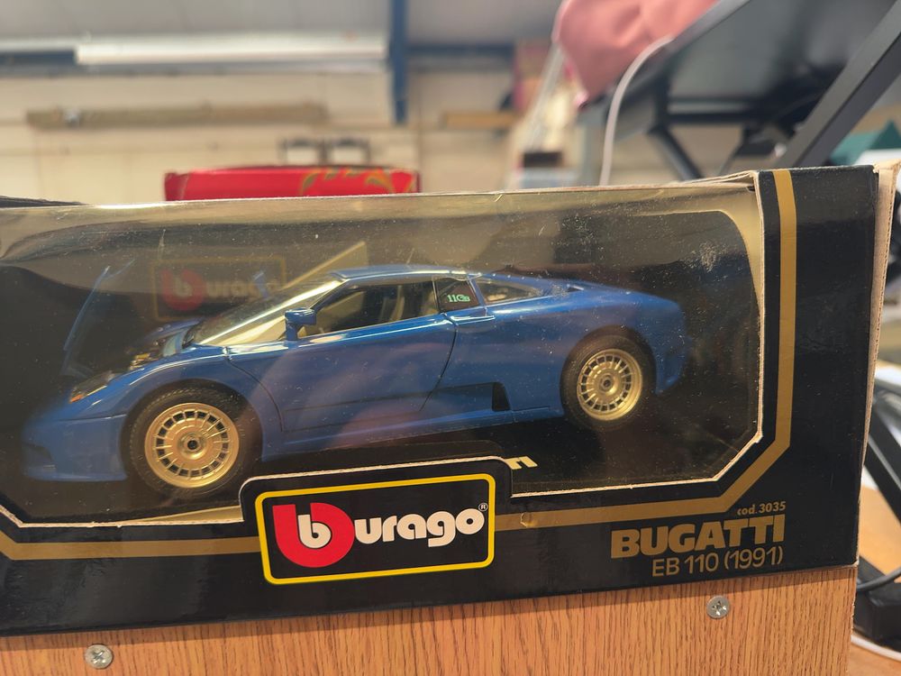 Lot 142: A Trio of Three Boxed Die-Cast Model Cars Including Bburago Examples