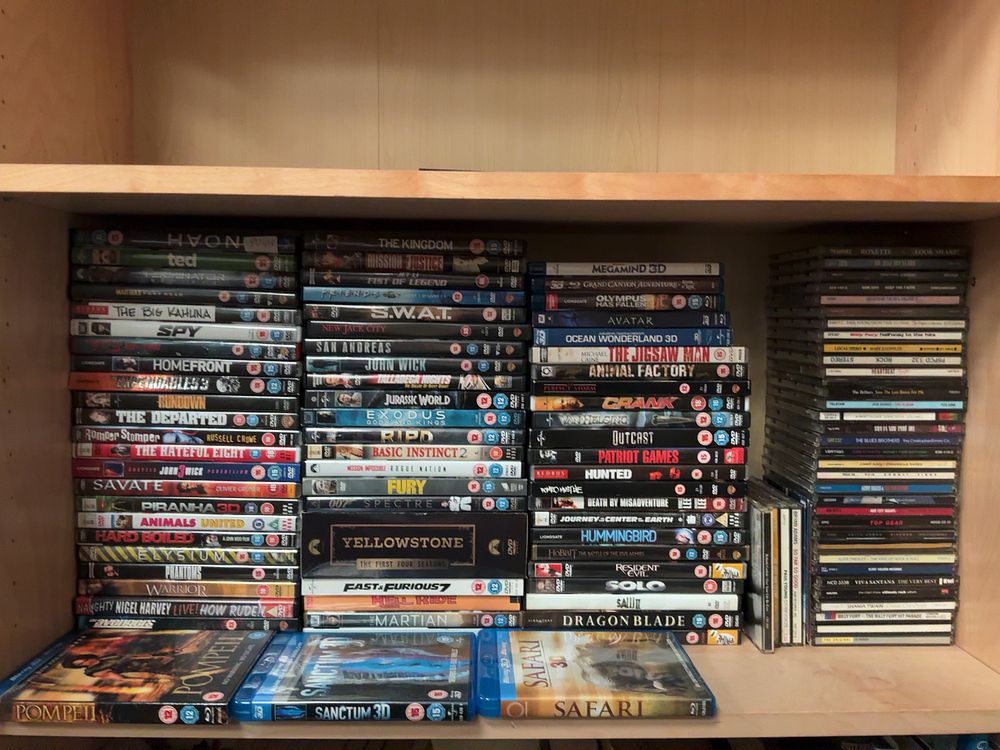 Lot 147: A Collection of DVD and Blu-ray Film Media and Audio CDs Including Yellowstone and John Wick Titles