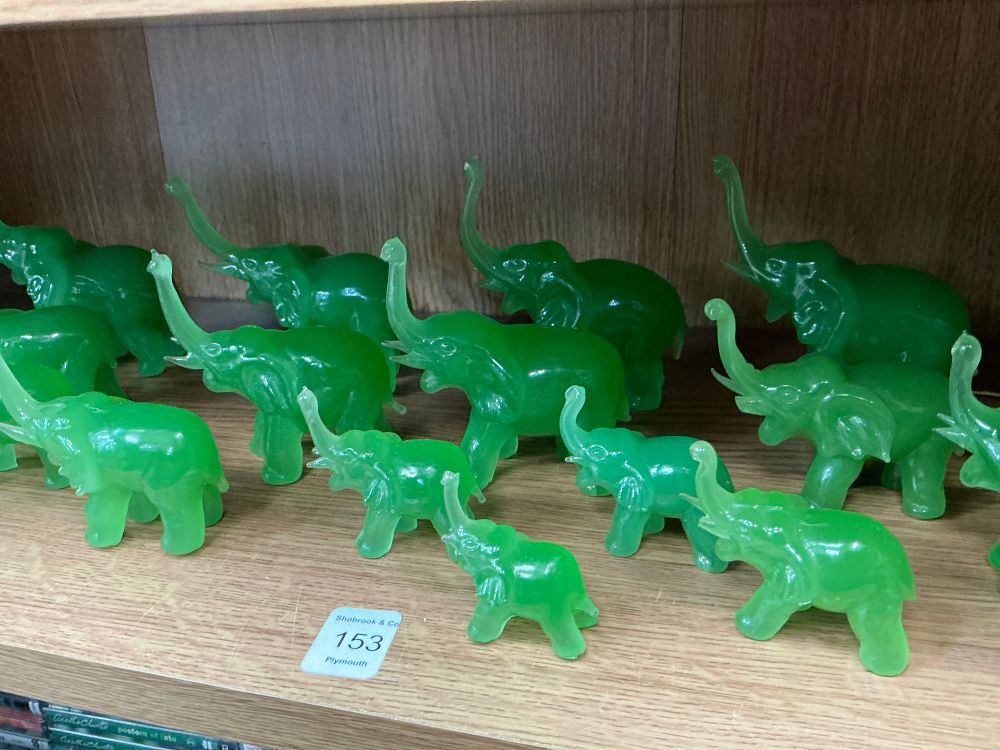 Lot 153: A Collection of Translucent Green Glass style Elephant Figurines