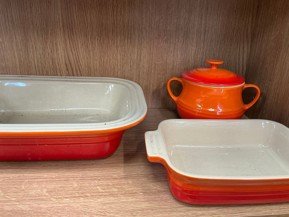Lot 160: A Set of Five Le Creuset Glazed Stoneware Baking Dishes and Cocottes