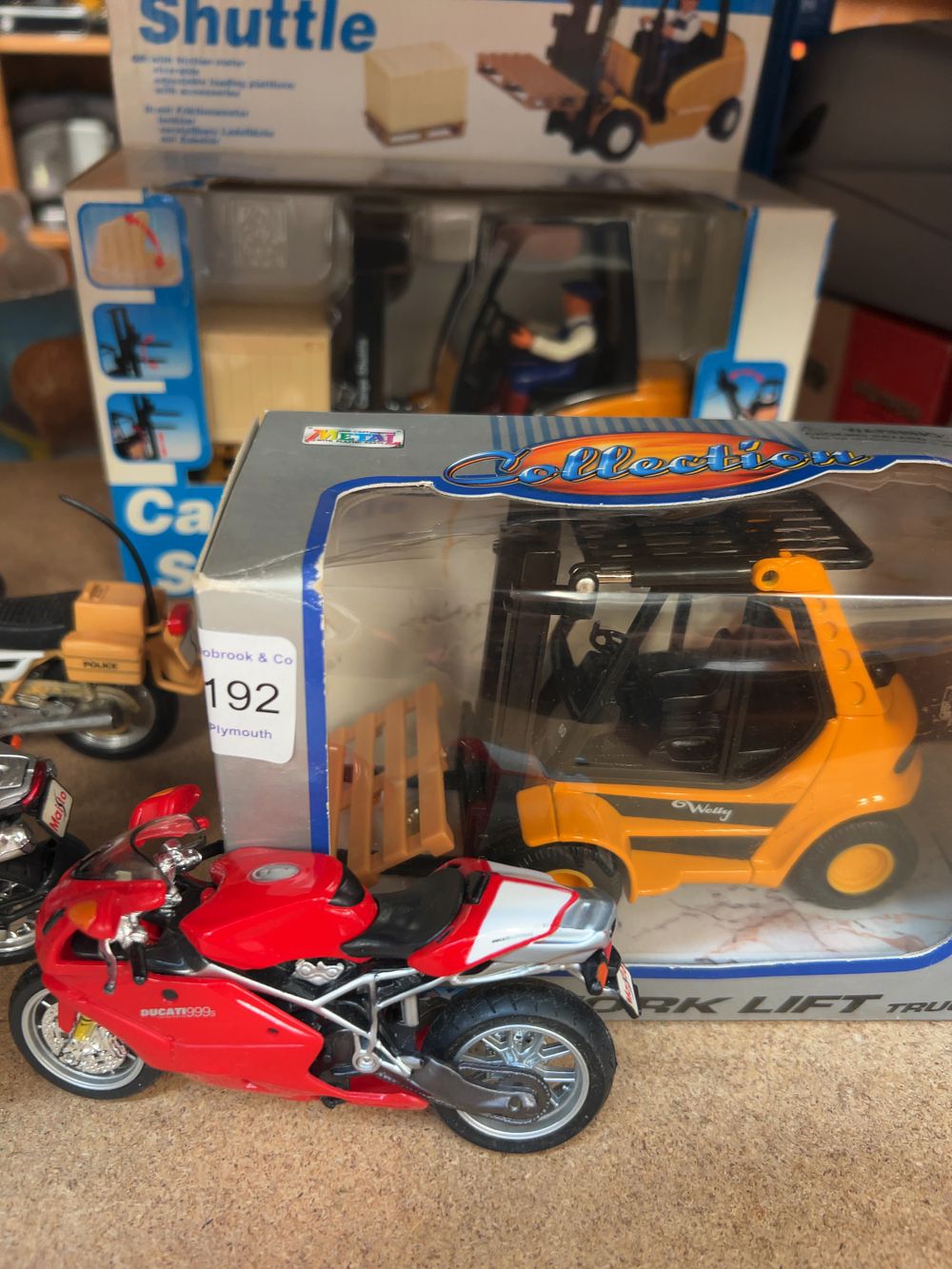 Lot 192: A Collection of Die-cast and Plastic Model Vehicles Including Welly and Maisto Examples