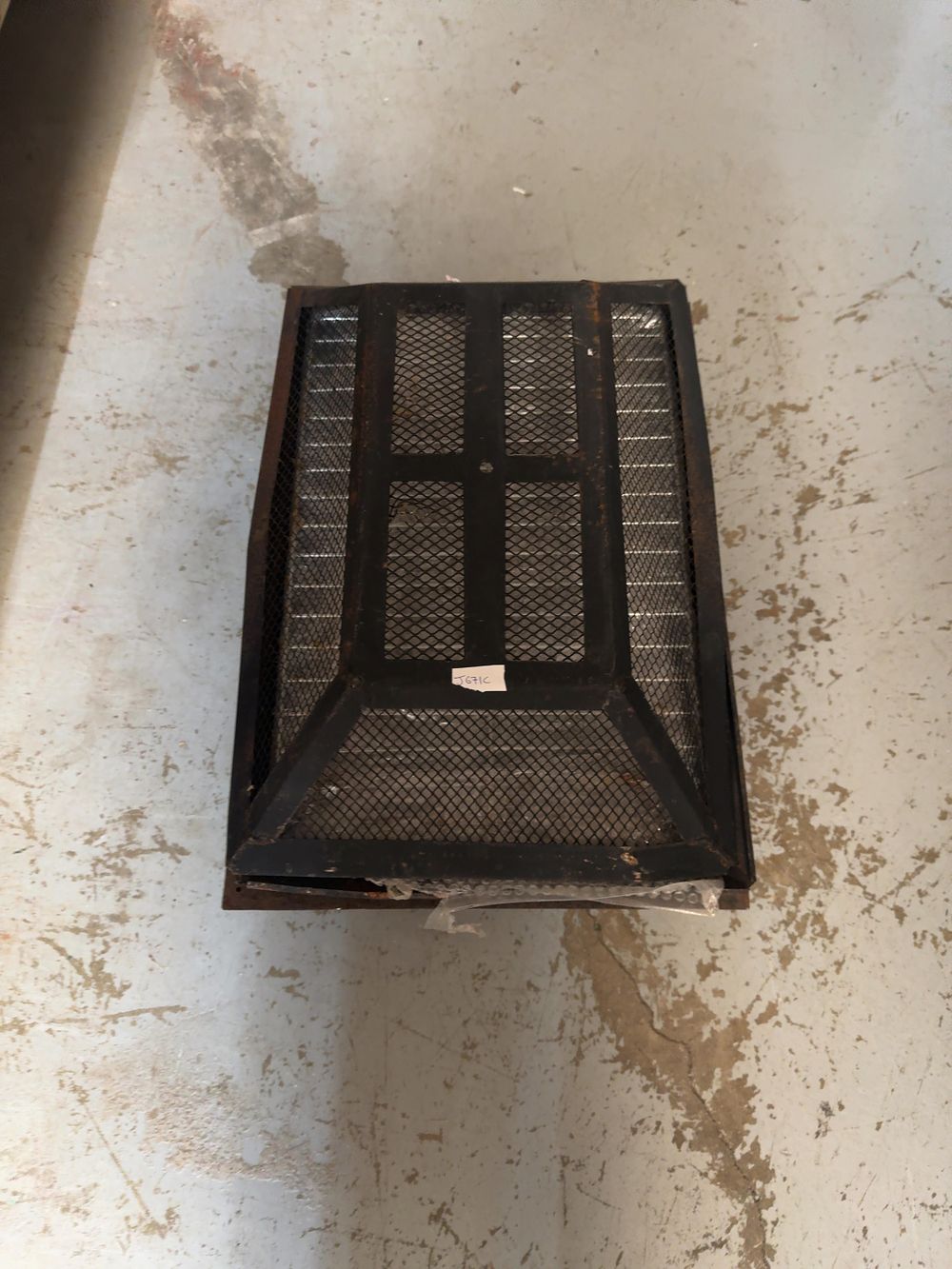 Lot 218: A Steel and Wire Mesh Wood-Burning Fire Pit