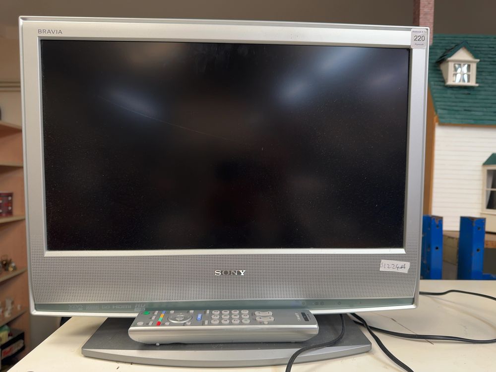 Lot 220: A Sony Bravia KDL-20S2020 20-Inch LCD Television with Remote Control