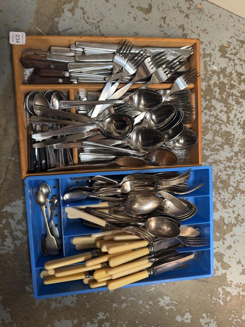 Lot 234: A Collection of Assorted Flatware and Cutlery including Sheffield Stainless Steel and Silver-Plated Examples in Two Trays
