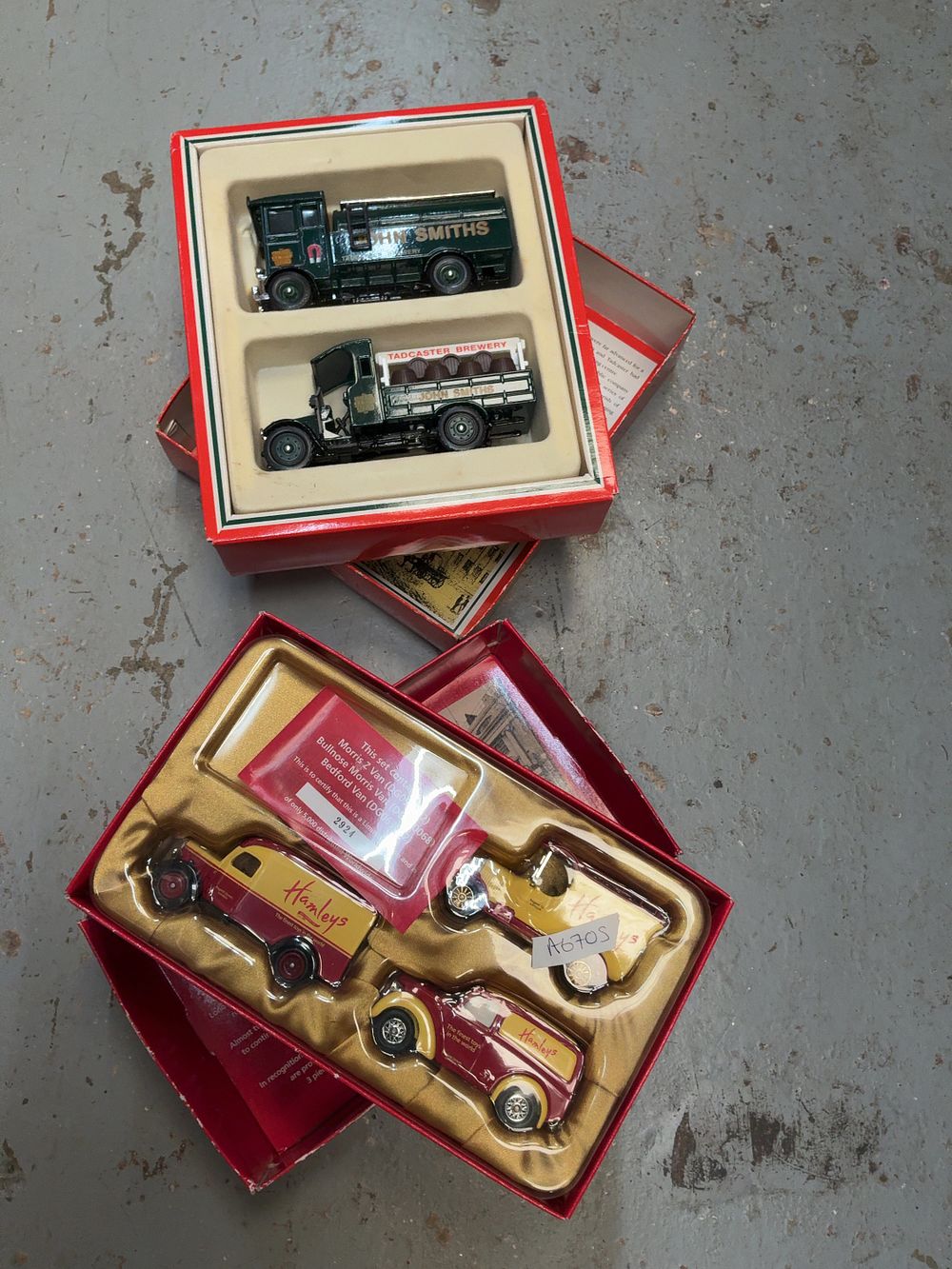 Lot 242: A Pair of Corgi and Lledo Die-cast Commercial Vehicle Sets Including John Smiths and Hamleys Examples in Cases