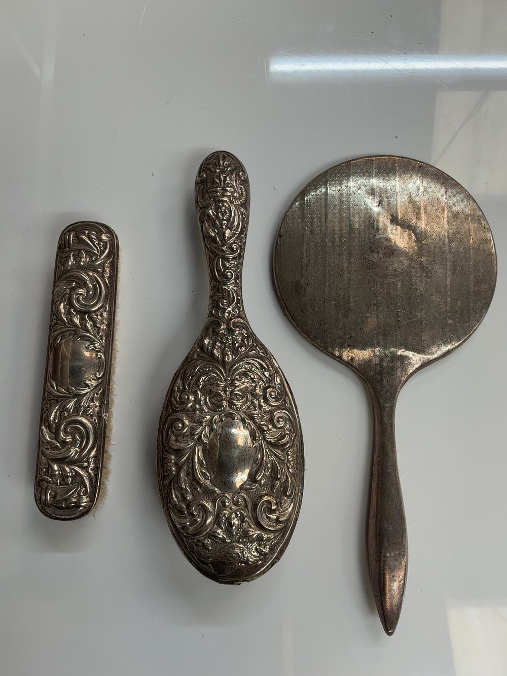 Lot 261: A Trio of Sterling Silver Dressing Table Items including Barker Brothers and S. Blanckensee & Son Ltd Examples