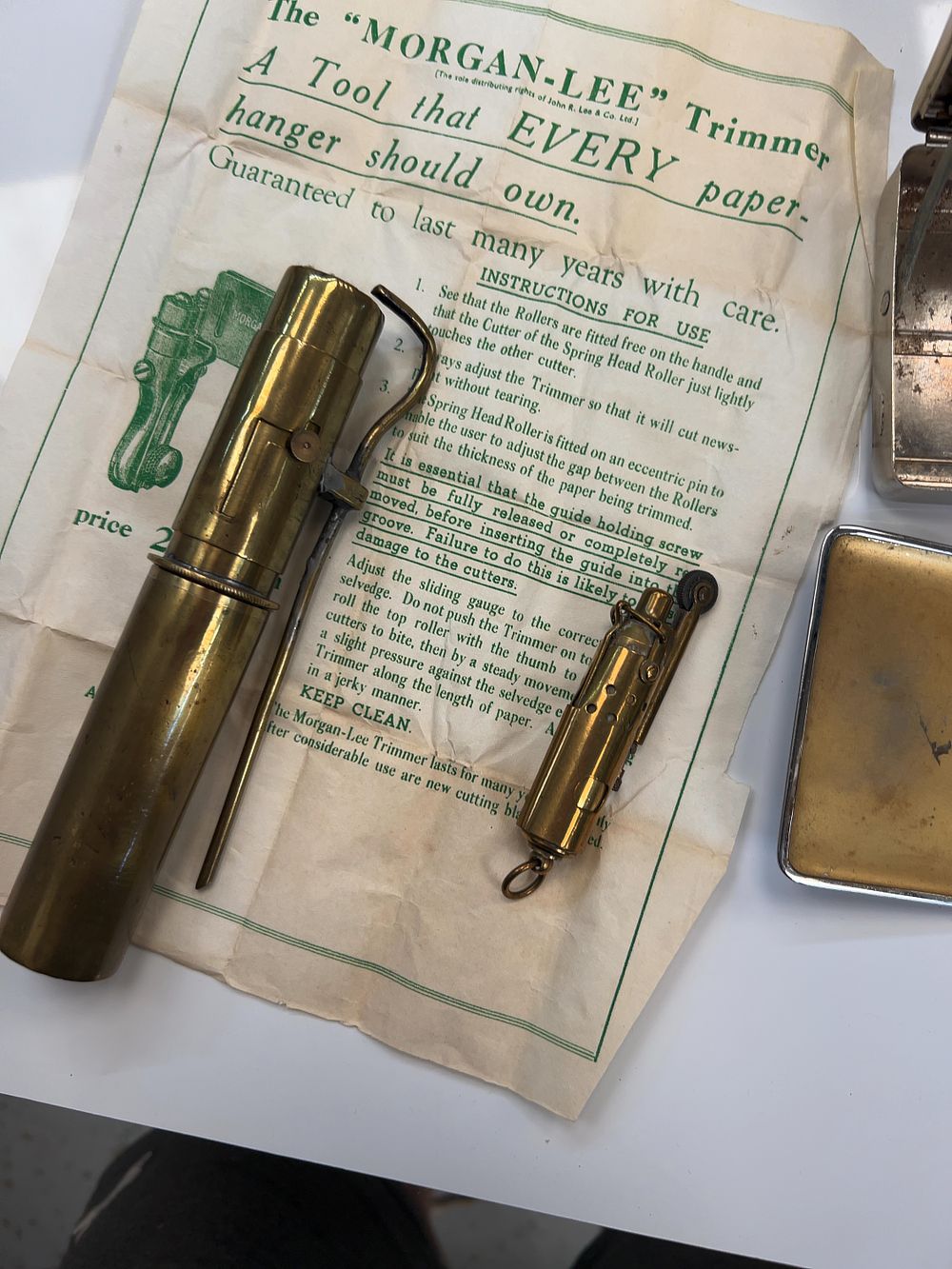 Lot 262: A Collection of Vintage Metalware and Tobacco Accessories including a JOB Cigarette Rolling Box and Trade Ephemera