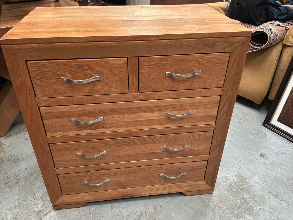 Lot 277: A Contemporary JB Global Solid Oak Bevel Two-Over-Three Chest of Drawers