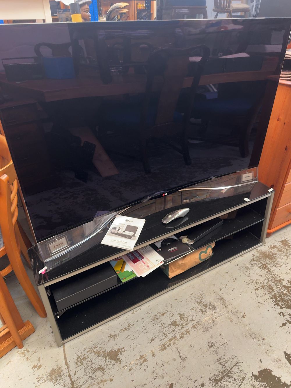 Lot 278: An LG 55 Inch Curved OLED 3D Smart Television with Remote and Documentation