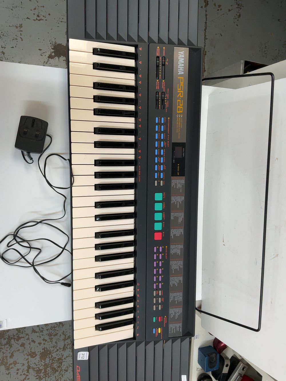 Lot 312: A Yamaha DASSYSTEM Electronic Keyboard with Music Rest and Power Adapter