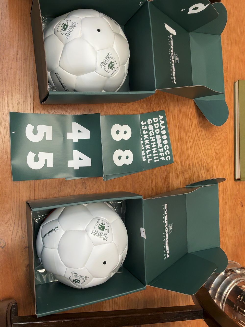 Lot 323: A Pair of Two P.A.F.C. style Commemorative Synthetic Soccer Ball Presentation Sets with Presentation Cases