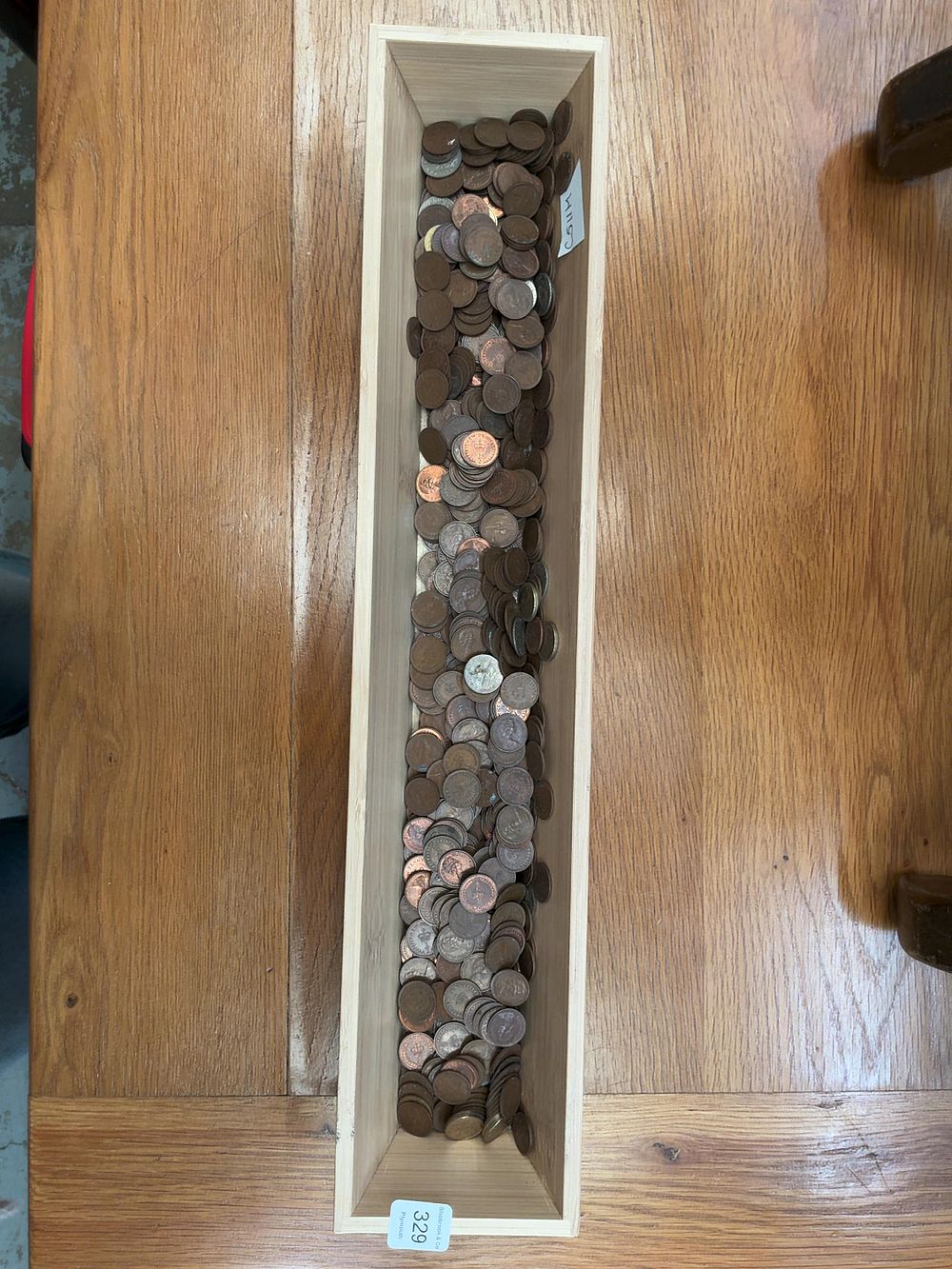 Lot 329: A Collection of UK and US Bronze and Cupro-nickel Coins including Pre-decimal Examples