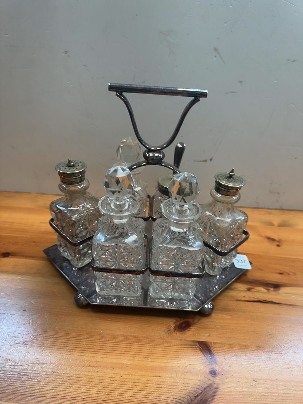 Lot 337: A Set of Six Victorian style Silver-Plated and Cut Glass Cruet Bottles in a Stand