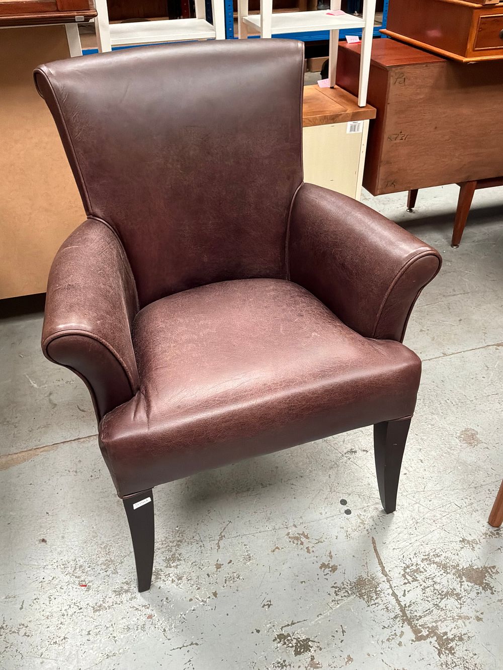 Lot 341: A Laura Ashley Conway Distressed Cattle Hide Leather Armchair