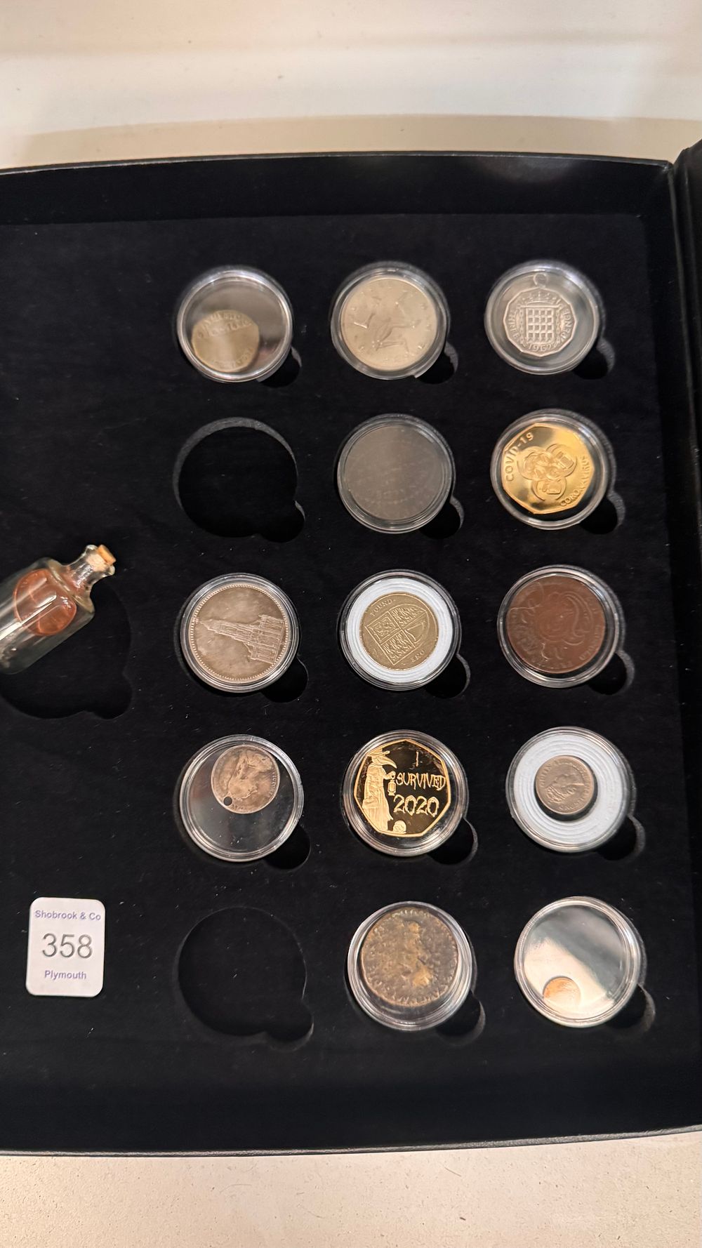 Lot 358: A Collection of Coins and Commemorative Tokens Including Novelty Examples in a Display Case