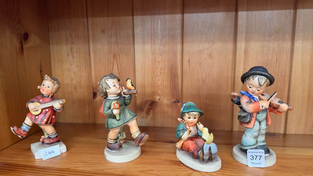 Lot 377: A Collection of Goebel M.I. Hummel Hand Painted Porcelain Figurines Including Little Fiddler and Gay Adventure