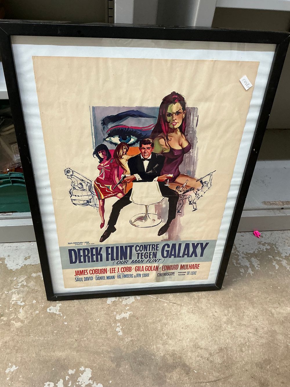 Lot 379: A Framed 1960s Verstegen Printed Paper Belgian Theatrical Movie Poster for Our Man Flint