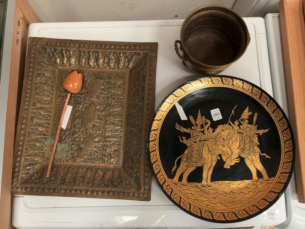 Lot 393: A Collection of Four Decorative Items including a Southeast Asian style Metal Plaque and Thai style Charger