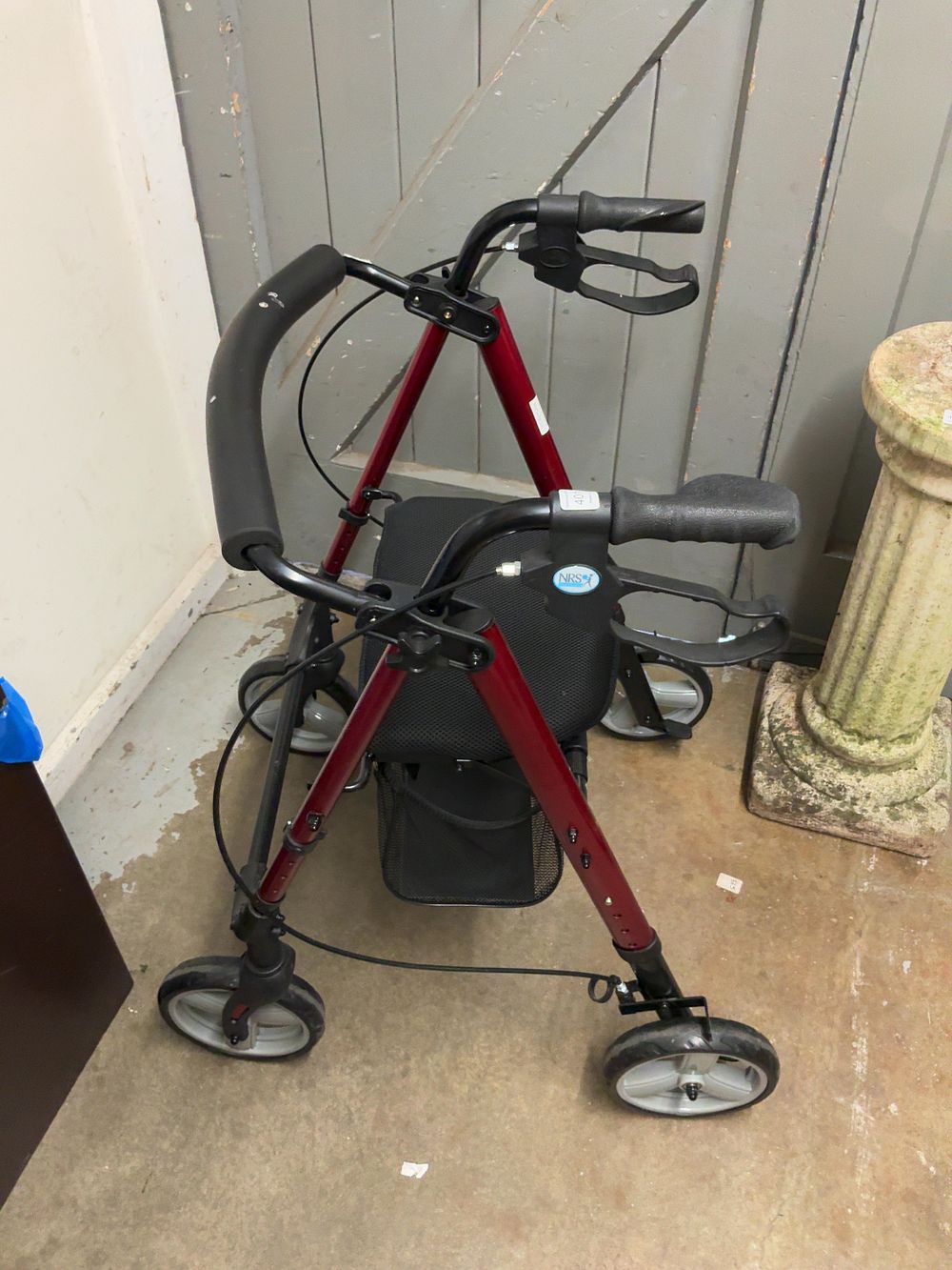 Lot 401: An NRS Healthcare Red Metal Mobility Rollator Walker