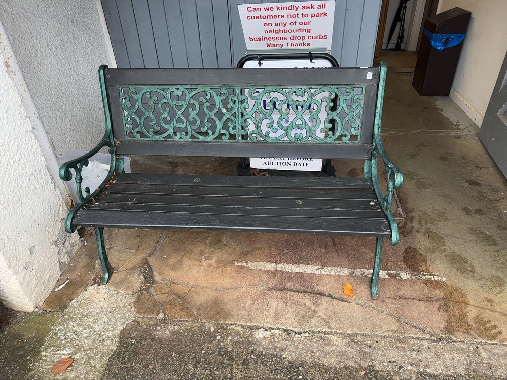 Lot 57: A Victorian Style Cast Iron and Wooden Garden Bench